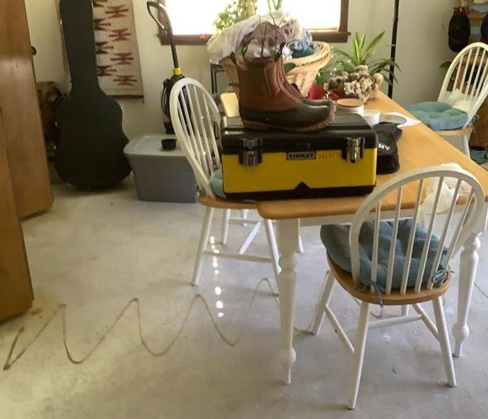 The same room in Flagstaff, Arizona, after the flooring was removed and everything was dried