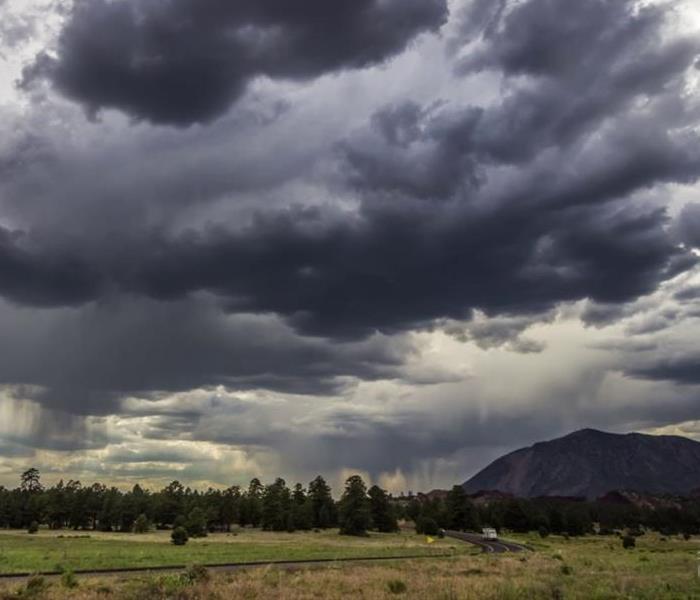 A large storm over the San Francisco Peaks during monsoon season in Flagstaff, Arizona